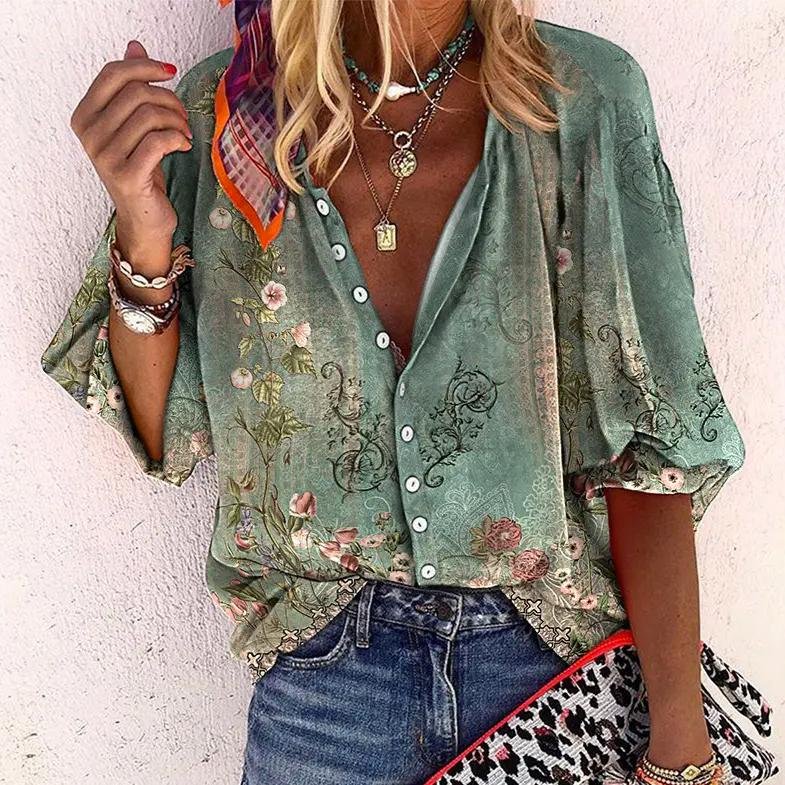 Women's floral V-neck blouse, short sleeve, button front. Perfect for bohemian summer fashion.