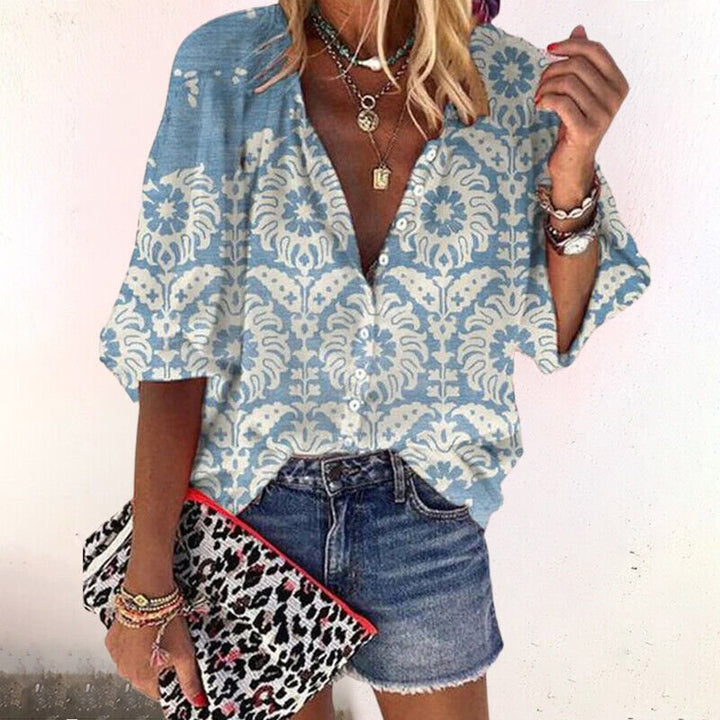 Feminine bohemian floral V-neck blouse for women, short-sleeve, button-front, great for summer casual fashion.