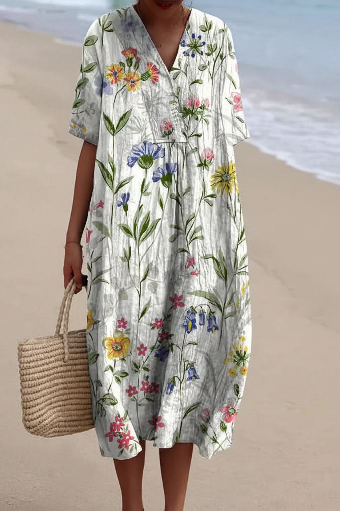 Flowy women's floral V-neck midi dress, comfortable for everyday wear or a chic summer day out. Effortless style.