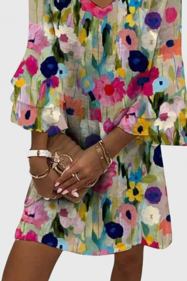 Flowy, lightweight women's floral V-neck mini dress; ideal as a cute short summer party or day dress.