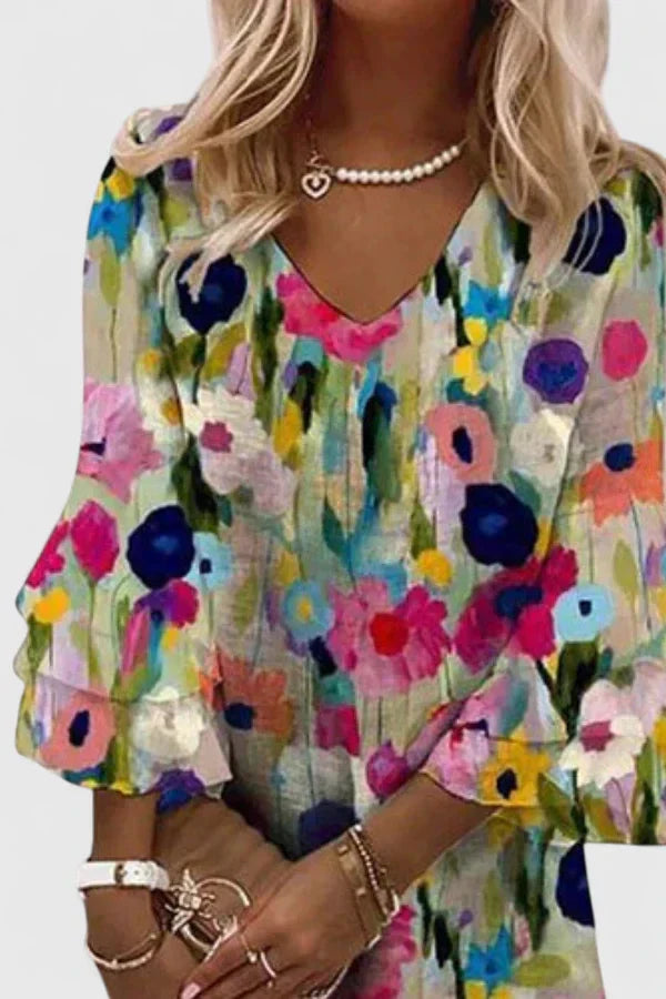 Vibrant floral print V-neck mini dress for women, featuring a flattering short, flowy silhouette for summer.