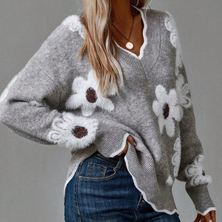 Women's floral V-neck sweater with textured knit, long sleeves, and a relaxed fit for casual style.