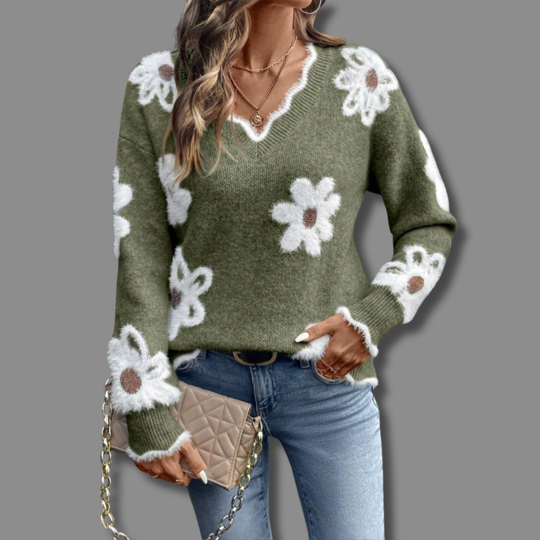 Relaxed fit women's V-neck sweater with a chic floral print and soft, textured knit fabric; very cozy.