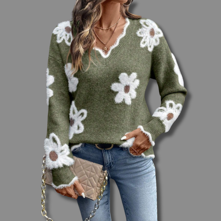 Relaxed fit women's V-neck sweater with a chic floral print and soft, textured knit fabric; very cozy.