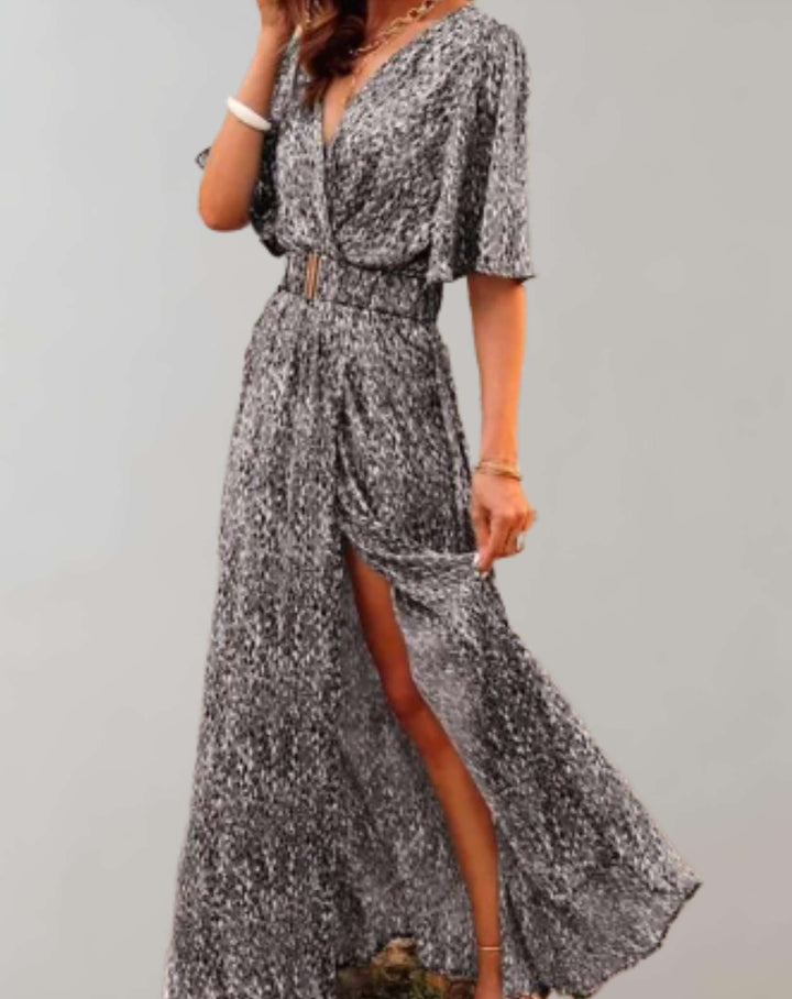 Beautiful floral printed long maxi dress with a feminine v-neck, elegant wrap front, and chic side slit.