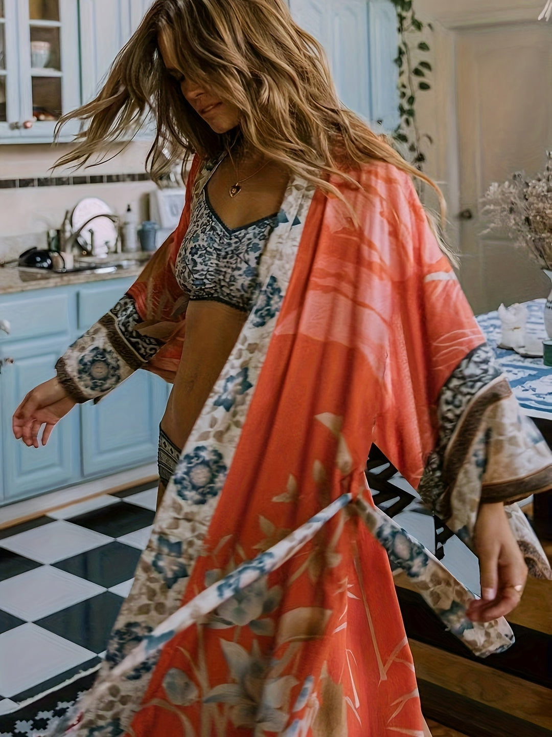 Soft, flowing women's floral print resort kimono, lightweight for ultimate summer comfort.