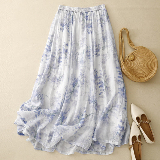 Women's flowing pleated midi skirt with an adjustable drawstring waist, perfect for casual summer boho style.