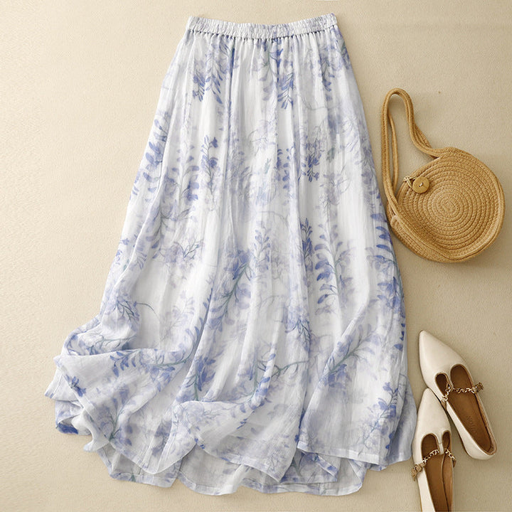 Women's flowing pleated midi skirt with an adjustable drawstring waist, perfect for casual summer boho style.