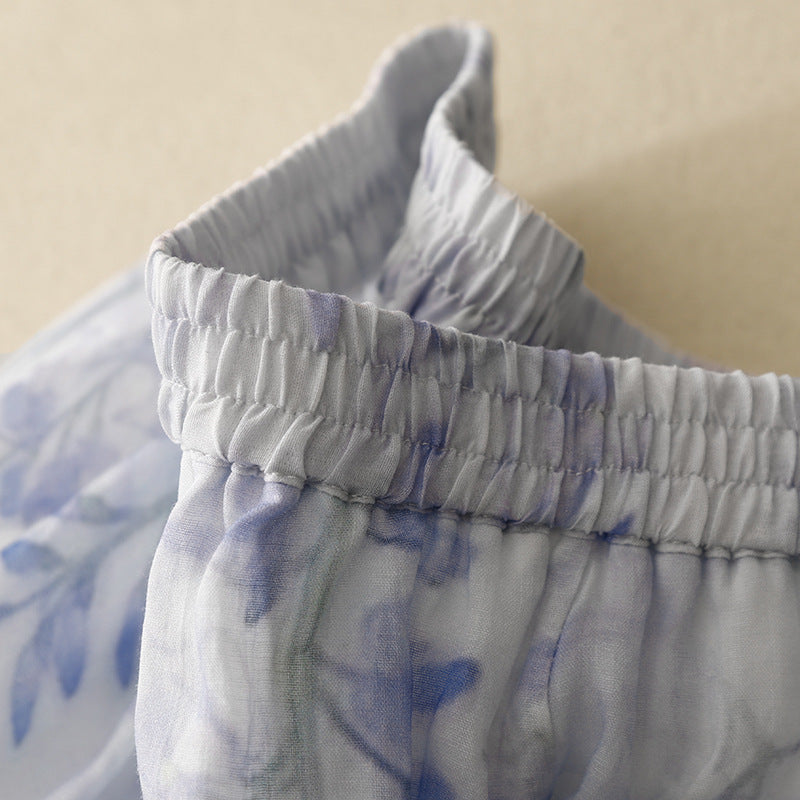 Versatile women's pleated midi skirt, flowy design & drawstring waist. Great for casual or dressed-up summer fashion.