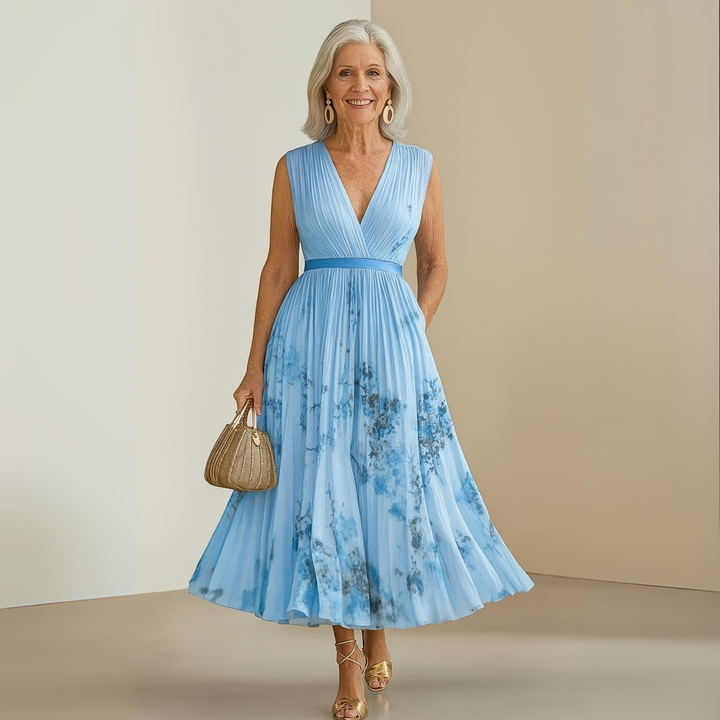 Detailed shot of the elegant V-neck on a women's flowing sleeveless maxi dress, stylish for summer and vacation.