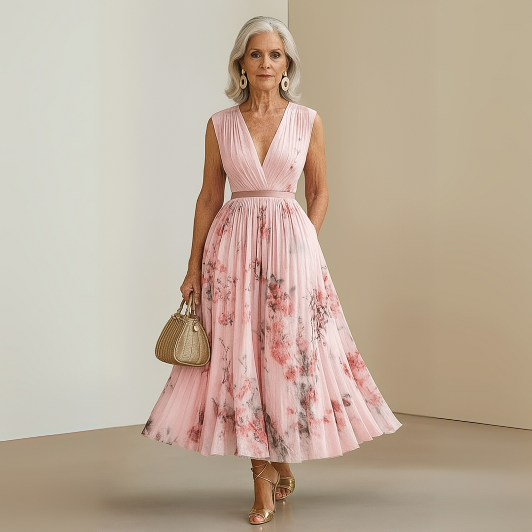 Women's flowing sleeveless maxi dress in motion, showcasing the elegant drape and effortless summer style.
