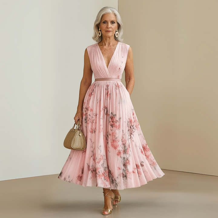 Women's flowing sleeveless maxi dress in motion, showcasing the elegant drape and effortless summer style.