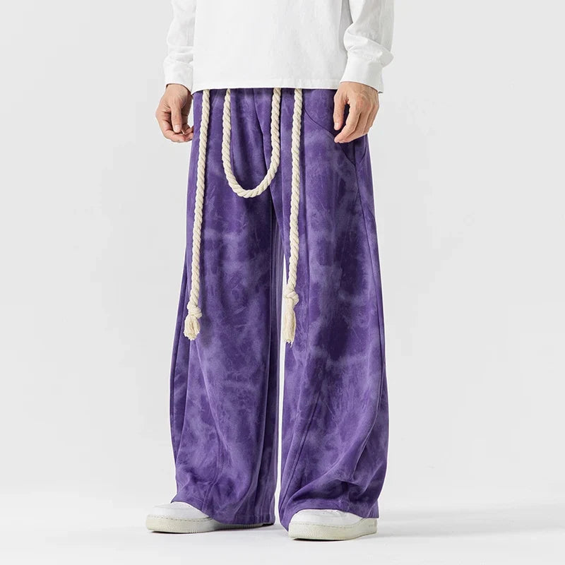 Women's flowing wide-leg pants with stylish rope belt, perfect for a relaxed, comfortable fit.