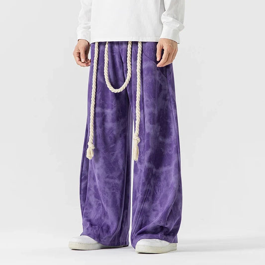 Women's flowing wide-leg pants with stylish rope belt, perfect for a relaxed, comfortable fit.