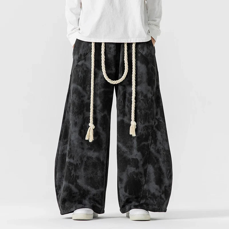 Women's wide-leg pants, featuring a distinctive rope belt. Comfortable and stylish for a relaxed fit.
