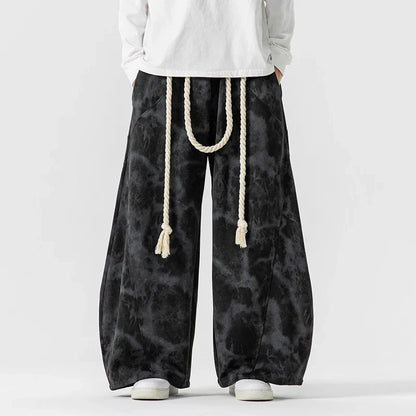 Women's wide-leg pants, featuring a distinctive rope belt. Comfortable and stylish for a relaxed fit.