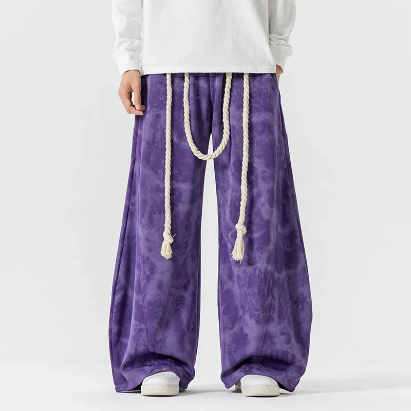 Modern women's wide-leg pants with a flowing silhouette and a fashionable rope belt. Great for casual fashion.
