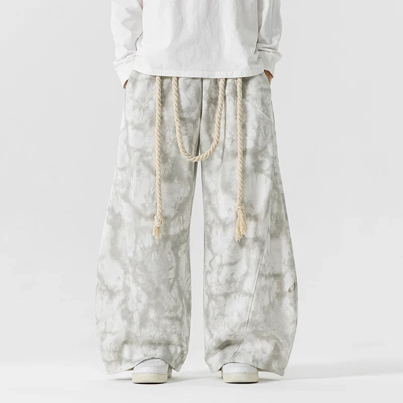 Stylish textured women's wide-leg pants, comfortable and flowing, cinched with a chic rope belt.