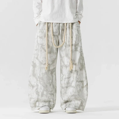 Stylish textured women's wide-leg pants, comfortable and flowing, cinched with a chic rope belt.
