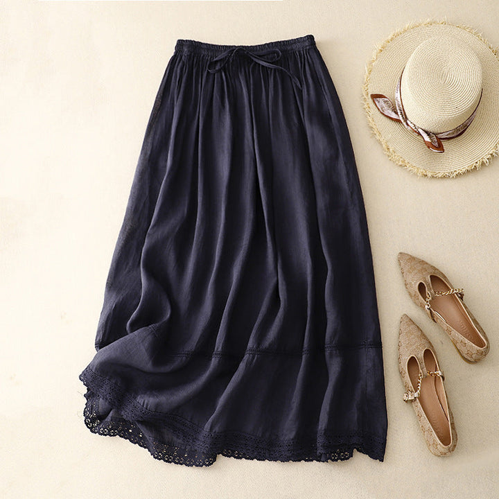 Graceful women's flowy A-line maxi skirt featuring delicate lace trim, a versatile piece for any wardrobe.