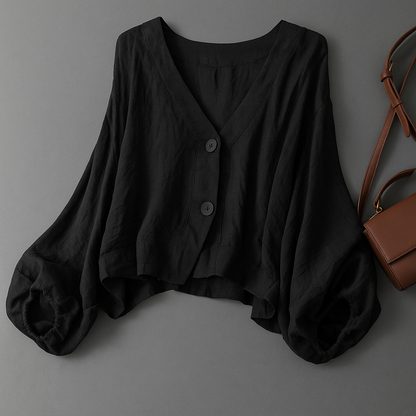 Comfortable women's flowy top with elegant balloon sleeves, versatile for summer casual wear or stylish work outfits.
