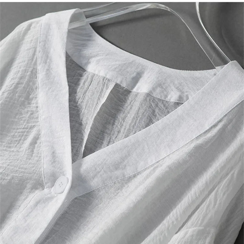 Stylish women's button-down blouse with beautiful balloon sleeves & flowy fabric, offering a relaxed and elegant look.