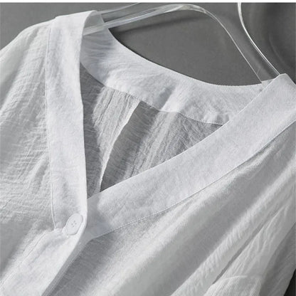 Stylish women's button-down blouse with beautiful balloon sleeves & flowy fabric, offering a relaxed and elegant look.