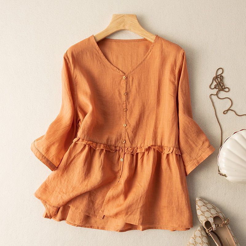 Elegant women's 3/4 sleeve blouse with ruffle detail and button-up front. A versatile flowy top for any occasion.