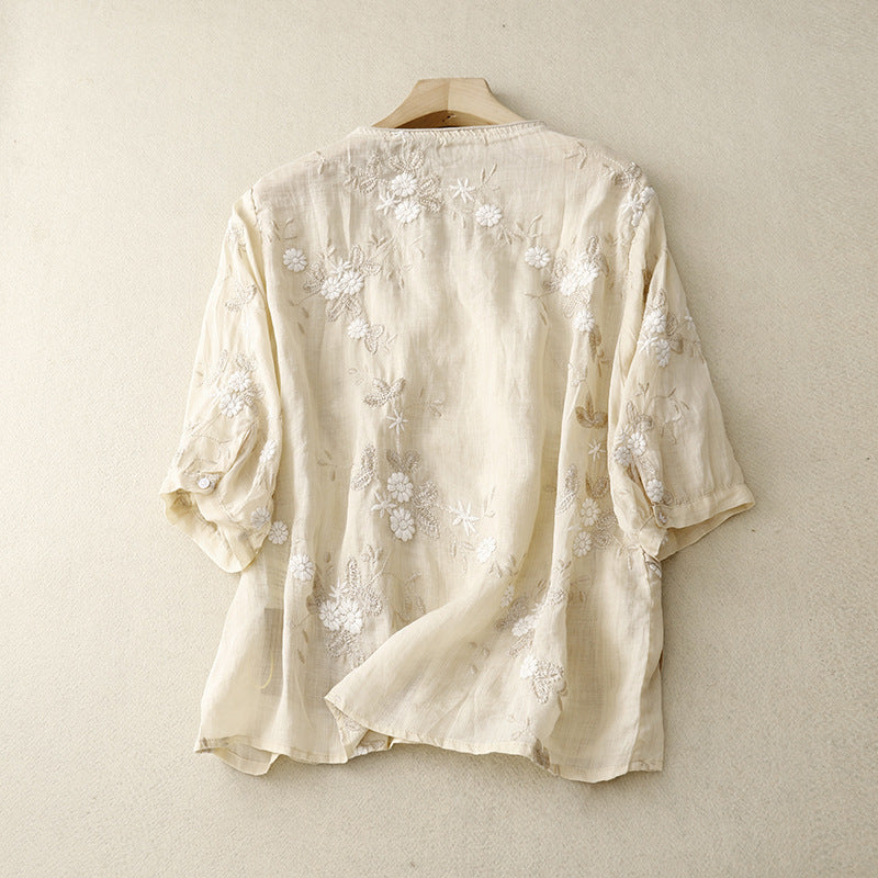 Close-up of a women's relaxed fit blouse featuring intricate floral embroidery, ideal for summer tops.