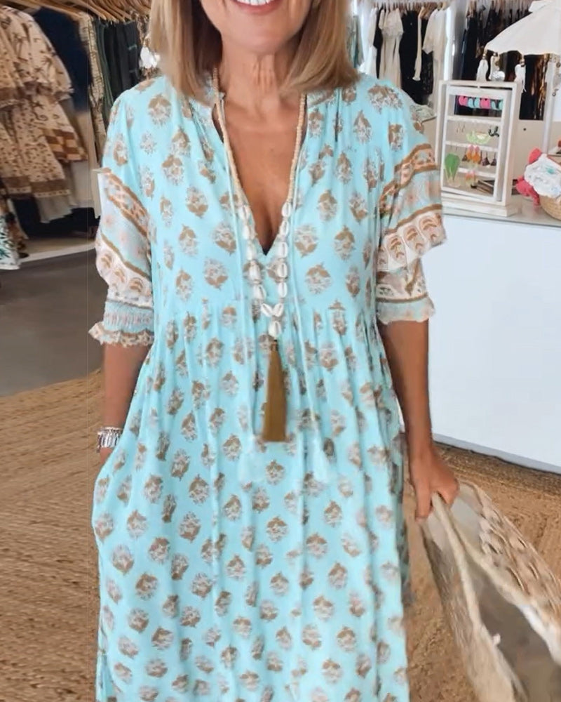 Elegant flowy bohemian midi dress for women, with comfortable lantern sleeves & essential pockets.