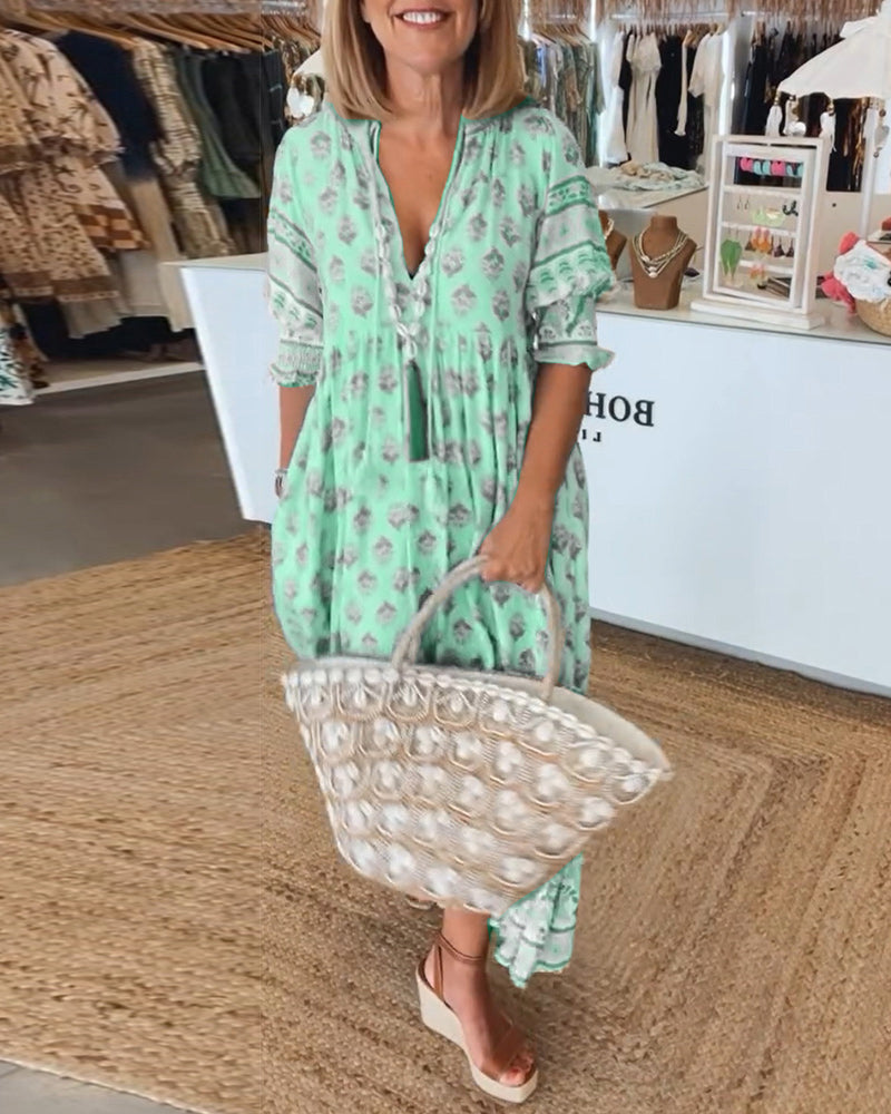 Spring/summer casual women's flowy midi dress, bohemian style with a flattering V-neck & pockets.