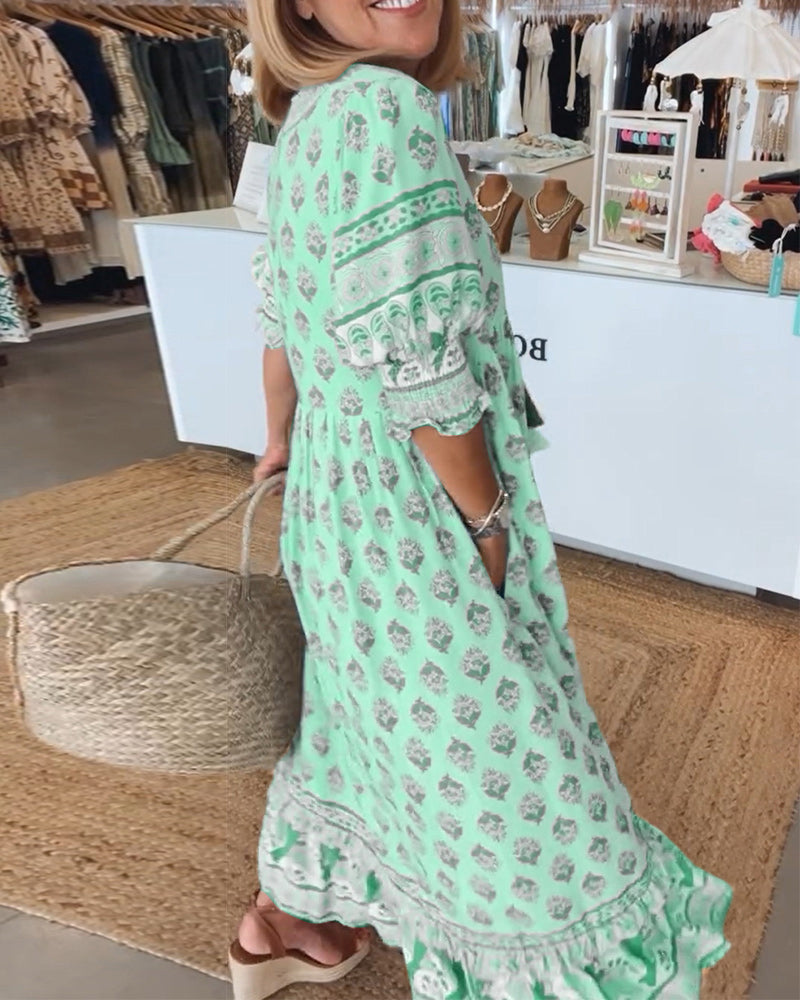 Women's bohemian flowy midi dress, featuring elegant lantern sleeves & functional pockets.