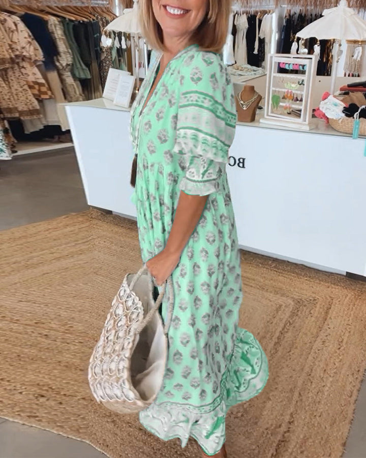V-neck flowy midi dress for women, comfortable bohemian style with convenient side pockets.