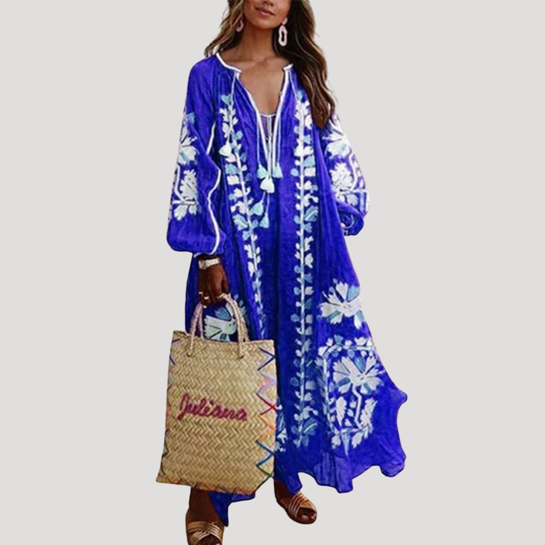 Bohemian women's maxi dress. Loose-fit, long-sleeve, V-neck, and elegant pattern for comfortable spring/summer style.