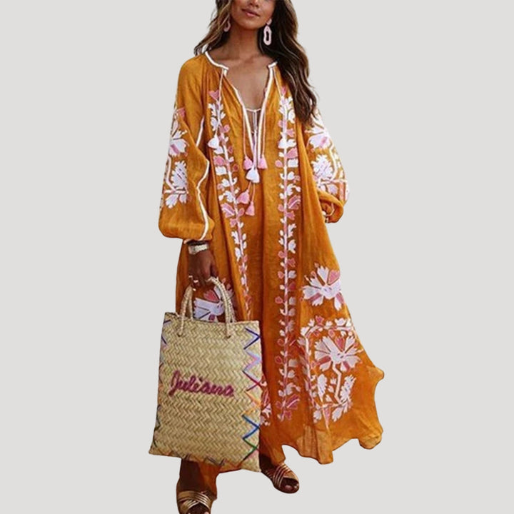 Patterned women's flowy maxi dress. Long sleeve V-neck bohemian style, perfect for comfortable summer and spring fashion.
