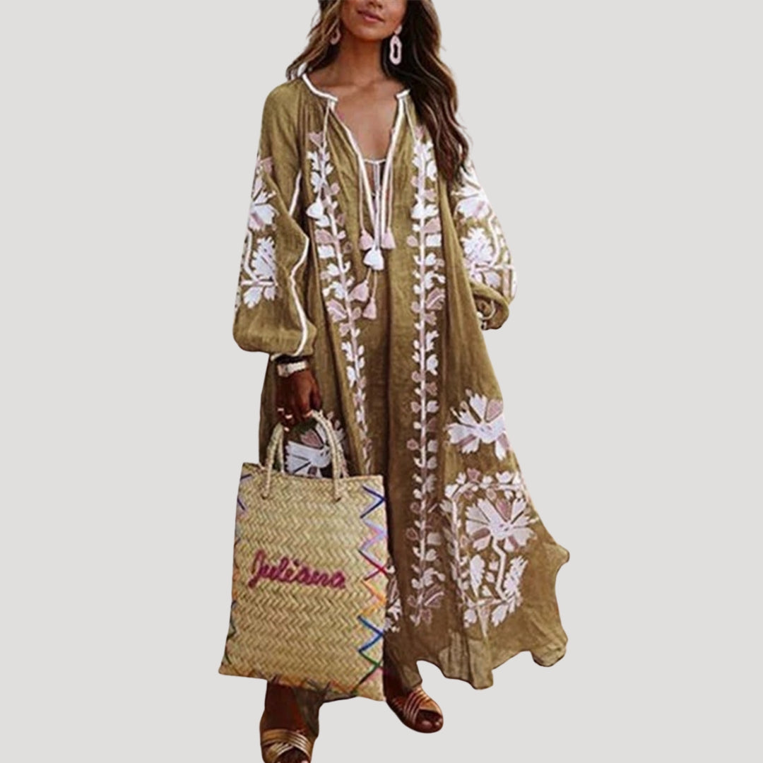 Stylish women's long-sleeve patterned boho maxi dress. V-neck, loose fit, and flowy design for a chic spring/summer look.