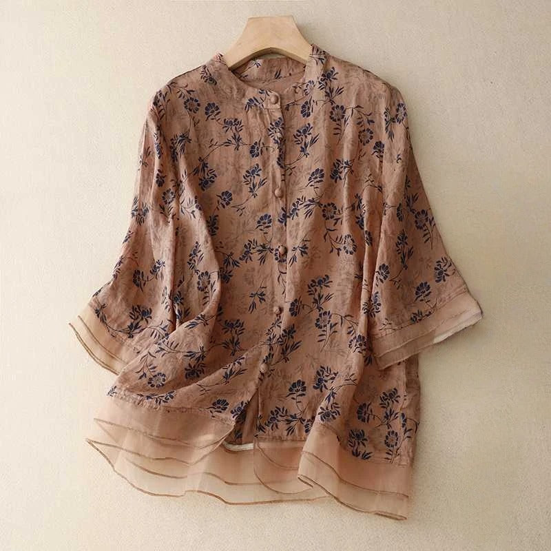 Elegant women's blouse with a vibrant floral pattern, featuring a flowy design for effortless spring style.