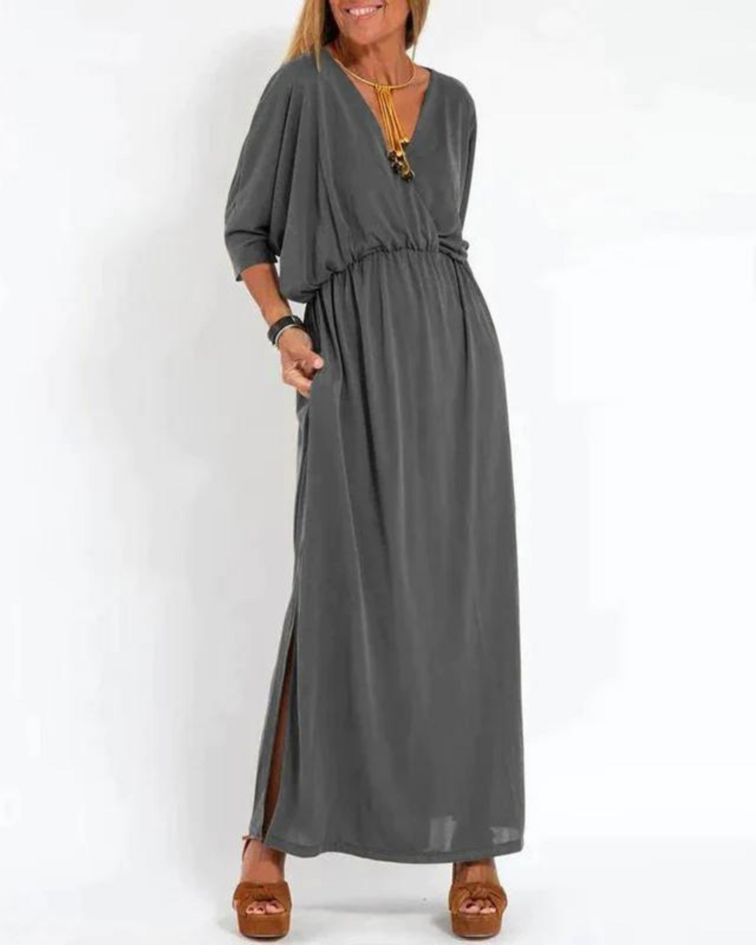 Elegant women's sleeveless maxi dress. This versatile summer dress features a comfortable flowy design & adjustable straps.