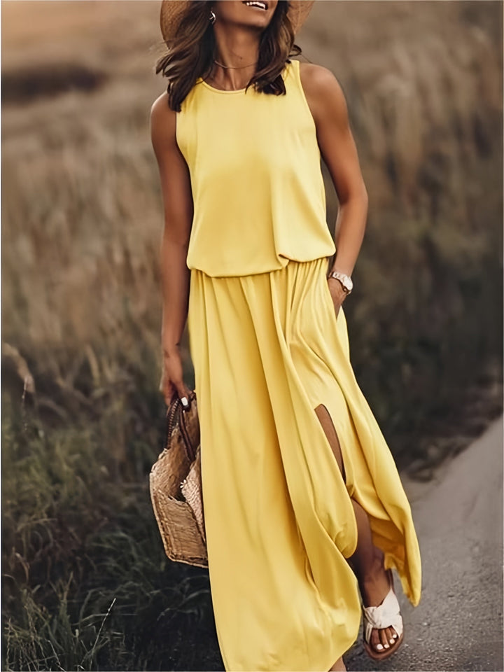 Women's flowy maxi dress, sleeveless with elastic waist, blouson top & stylish side slit for summer.