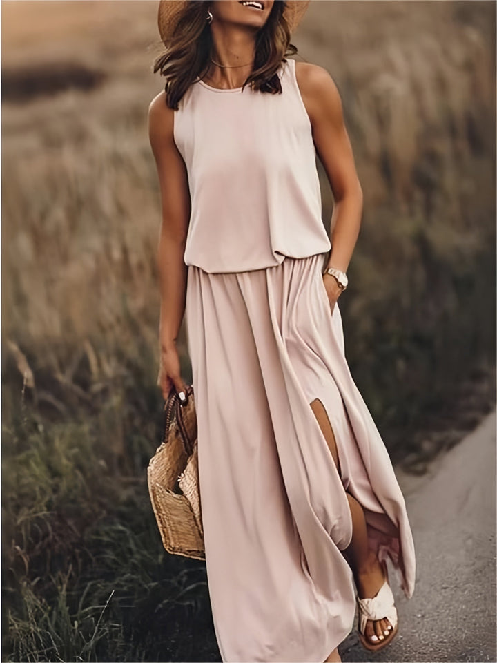Versatile women's summer maxi dress with flowy fabric, elastic waist & leg-baring side slit, perfect for vacation.