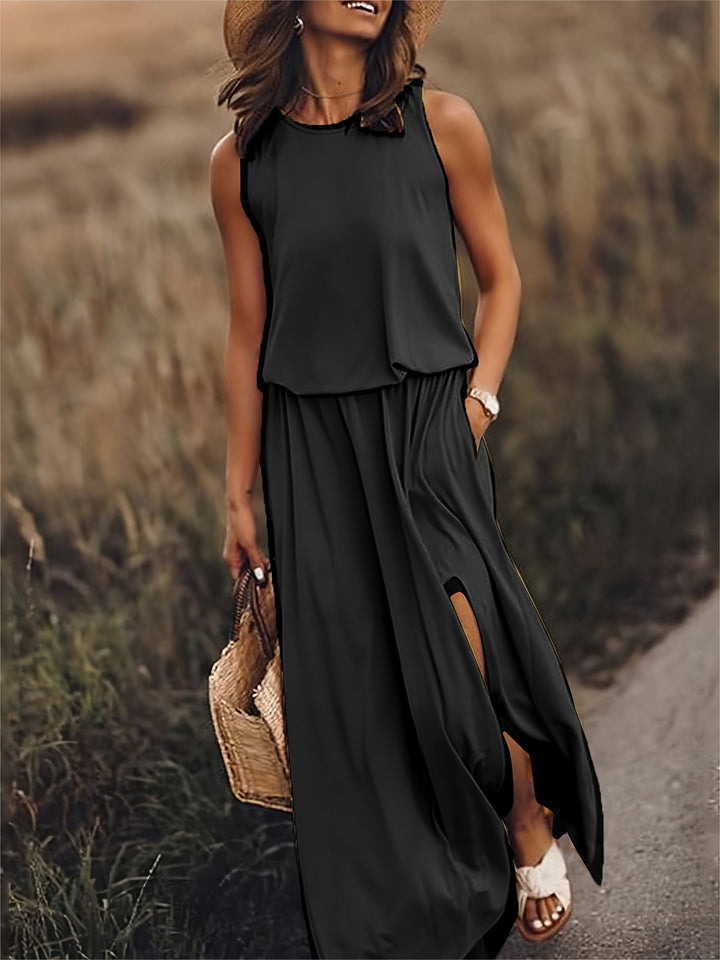 Comfortable women's flowy maxi dress, sleeveless with blouson top, elastic waist & elegant side slit detail.