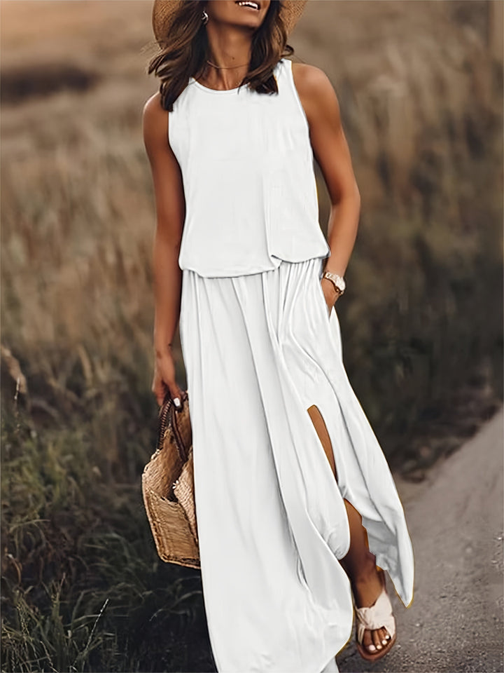 Chic women's flowy maxi dress in a relaxed fit, showing leg with a high side slit & elastic waist.