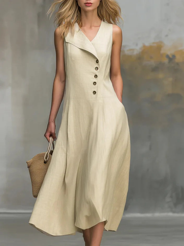 Women's flowy midi dress with asymmetrical button detail, V-neck, and sleeveless design for elegant summer style.