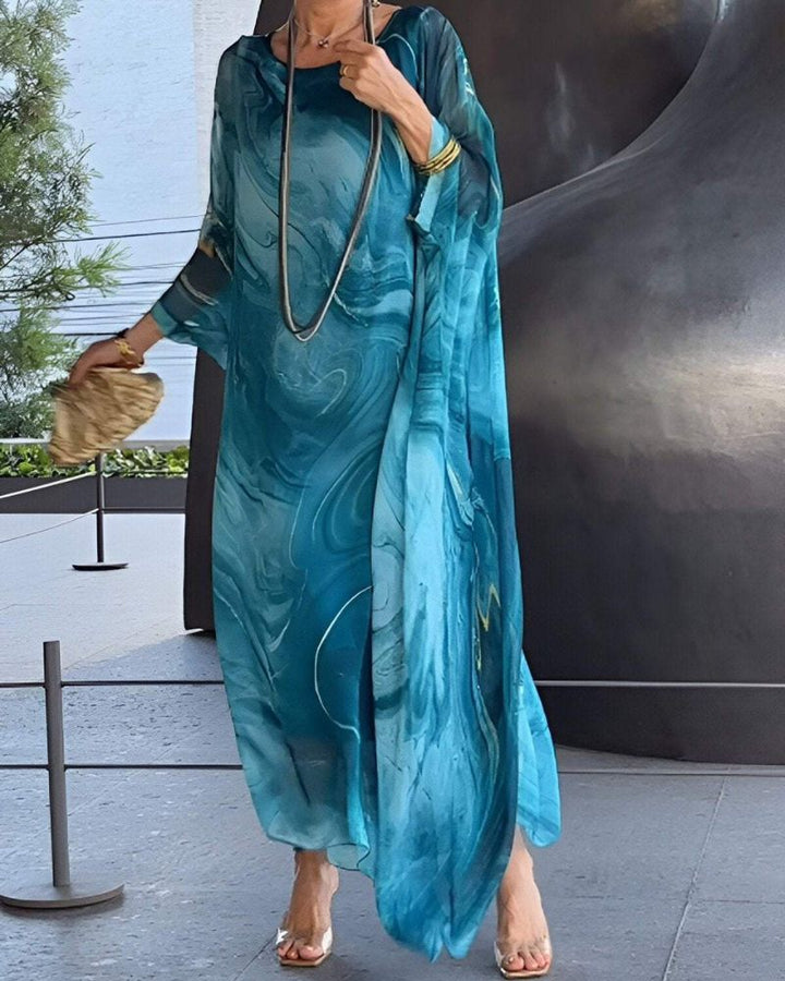 Women's flowy midi dress with tummy coverage, perfect for comfortable and elegant summer style.
