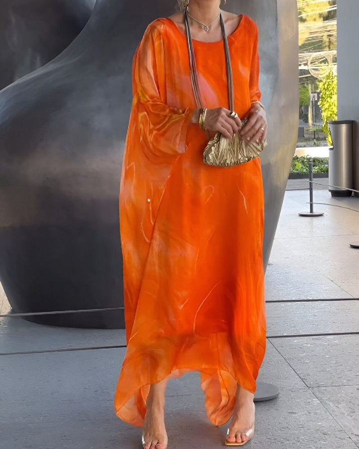 Versatile women's flowy midi dress in orange, offering comfortable tummy coverage for casual or elegant looks.