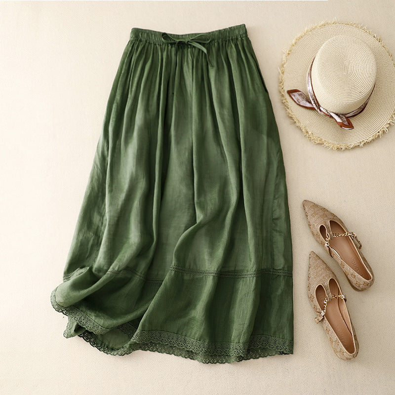Comfortable women's flowy midi skirt featuring a gathered waist & delicate scalloped lace hem for breezy summer style.