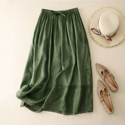 Comfortable women's flowy midi skirt featuring a gathered waist & delicate scalloped lace hem for breezy summer style.