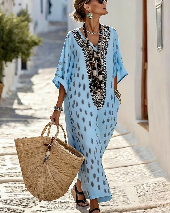 Ethnic flowy polka dot maxi kaftan dress with V-neck, ideal for summer vacation and casual style.