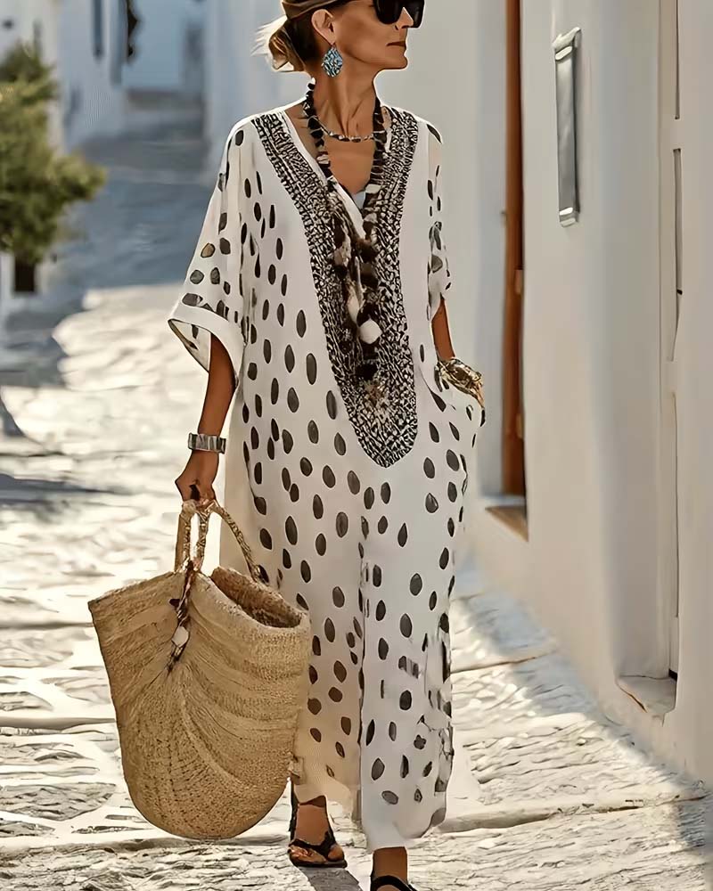 Women's polka dot maxi kaftan dress. Relaxed, flowy style with V-neck, perfect for ethnic summer wear.