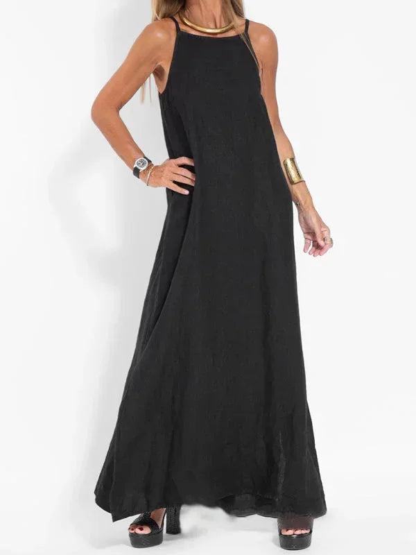 Vacation-ready flowy sleeveless maxi dress for women, stylish side slit, comfortable for any summer day.